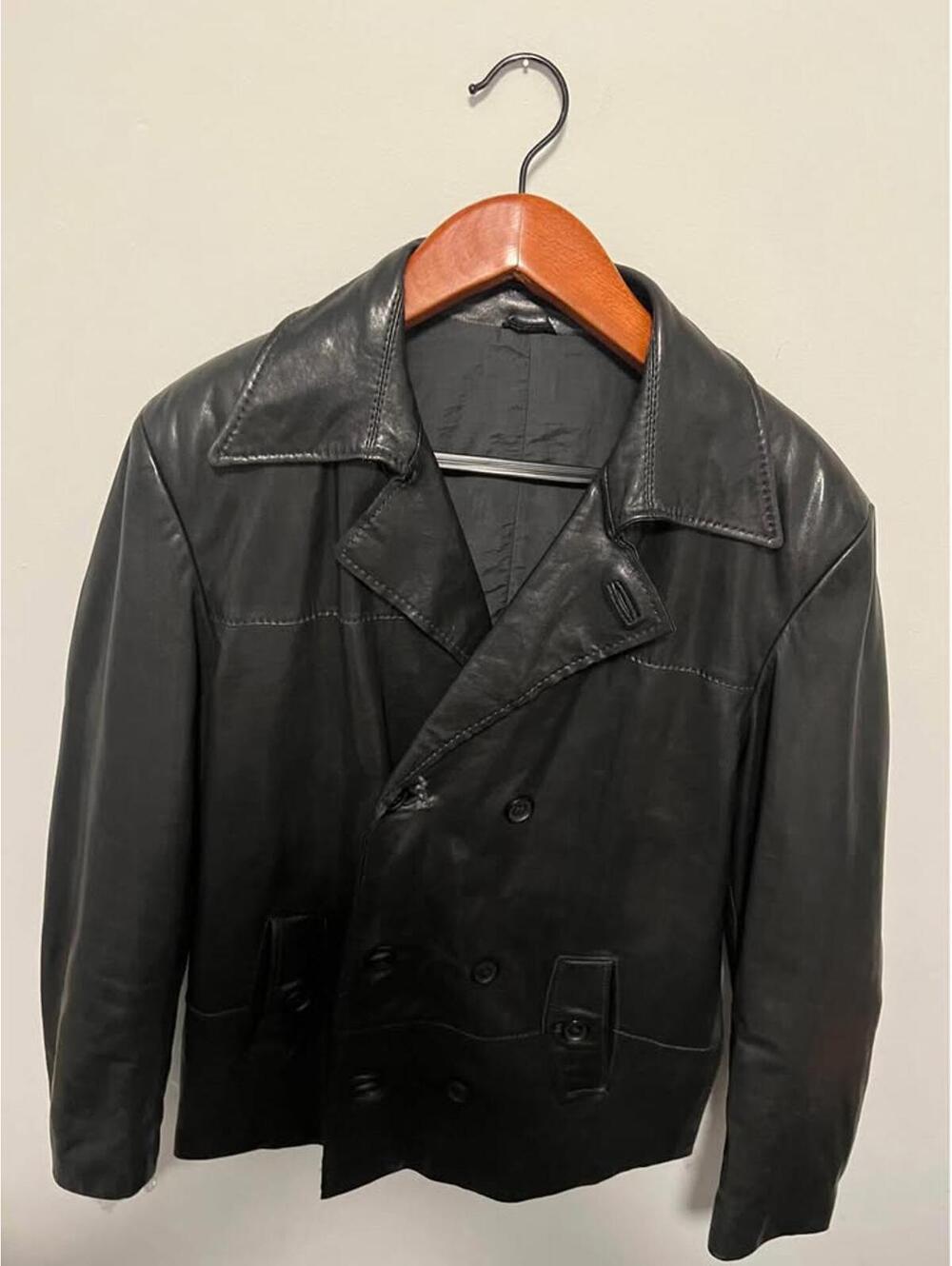Well, worn black double breasted   leather jacket